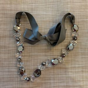 Grey and clear stone necklace with grey ribbon tie